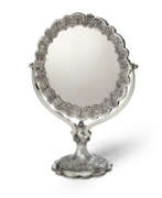 William Comyns. AN OTTOMAN SILVER REPOUSS&#201; MIRROR AND ASSOCIATED VICTORIAN SILVER STAND
