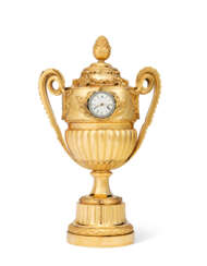A GEORGE III ORMOLU, SILVER AND PASTE-SET VASE TIMEPIECE TABLE CLOCK
