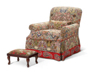 AN UPHOLSTERED CLUB CHAIR COVERED IN RESCHT EMBROIDERY