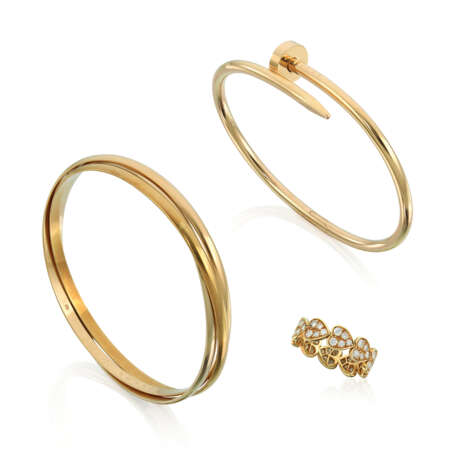 NO RESERVE - CARTIER 'JUSTE UN CLOU' AND 'TRINITY' BANGLE; TOGETHER WITH A CARTIER DIAMOND RING - photo 1