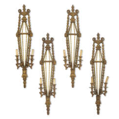 A SET OF FOUR NORTH ITALIAN GILT-COMPOSITION TWO-BRANCH WALL-LIGHTS