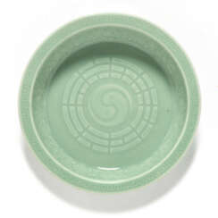 A CHINESE CELADON-GLAZED MOULDED &#39;BUDDHIST TRIGRAMS&#39; DISH