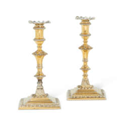 A PAIR OF GEORGE III SILVER-GILT TAPERSTICKS