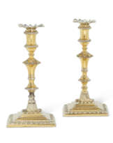 A PAIR OF GEORGE III SILVER-GILT TAPERSTICKS