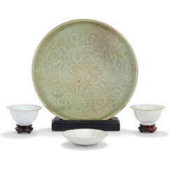 A CHINESE CELADON-GLAZED JAR AND COVER, ADAPTED AS A LAMP, A CELADON-GLAZED &#39;LOTUS&#39; BOWL, TWO DRAGON CUPS AND A QINGBAI FOLIATE DISH