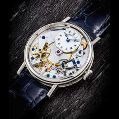 BREGUET. AN 18K WHITE GOLD SEMI-SKELETONISED WRISTWATCH WITH POWER RESERVE