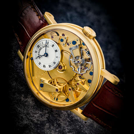 BREGUET. AN 18K GOLD SEMI-SKELETONISED WRISTWATCH WITH POWER RESERVE - фото 1