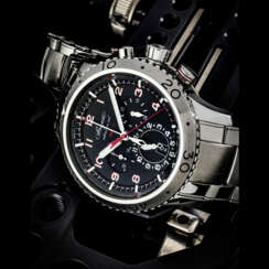 BREGUET. A STAINLESS STEEL AUTOMATIC FLYBACK CHRONOGRAPH WRISTWATCH WITH 1/10TH OF A SECOND, DUAL TIME, DATE AND BRACELET
