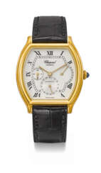 CHOPARD. AN ELEGANT 18K GOLD TONNEAU-SHAPED WRISTWATCH WITH DATE AND POWER RESERVE INDICATION