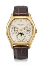 PATEK PHILIPPE. A RARE AND ELEGANT 18K GOLD TONNEAU-SHAPED AUTOMATIC PERPETUAL CALENDAR WRISTWATCH WITH MOON PHASES, 24 HOUR, LEAP YEAR INDICATION, ADDITIONAL CASE BACK, CERTIFICATE OF ORIGIN AND BOX