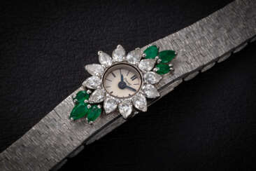 PIAGET, REF. 1340 A 6, AN ATTRACTIVE GOLD WRISTWATCH WITH DIAMOND AND EMERALD-SET BEZEL
