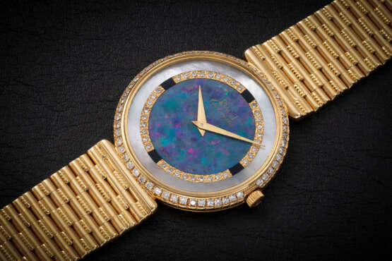 PIAGET, A GOLD AND DIAMOND-SET DIAL WITH MOTHER-OF-PEARL AND STONE DIAL - фото 1