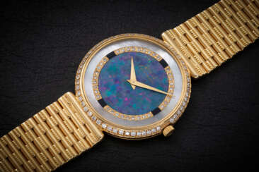 PIAGET, A GOLD AND DIAMOND-SET DIAL WITH MOTHER-OF-PEARL AND STONE DIAL 