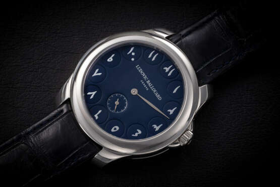 LUDOVIC BALLOUARD, A RARE PLATINUM WRISTWATCH WITH “UPSIDE DOWN” JUMPING HOURS AND EASTERN ARABIC DIAL - photo 1