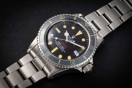 ROLEX, SEA-DWELLER REF. 1665 ‘DOUBLE RED’, A STEEL AUTOMATIC DIVER’S WATCH WITH ARABIC DATE - photo 1