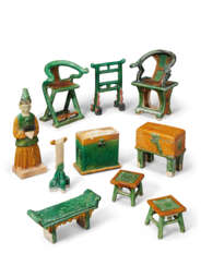 A GROUP OF 45 GREEN AND AMBER-GLAZED POTTERY FIGURES AND MODELS OF FURNITURE