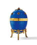 Victor Mayer. Decorative egg with violet blue enamel decor and set with gemstones