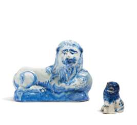 Resting lion with sphere and small crouching lion