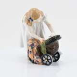 Girl with doll stroller - photo 2
