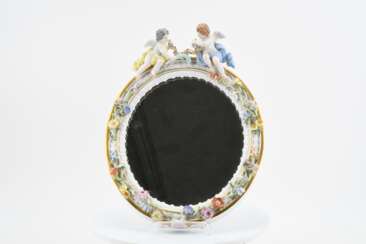 Oval wall mirror with putti decor