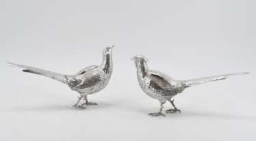 Figurines of a male and a female pheasant