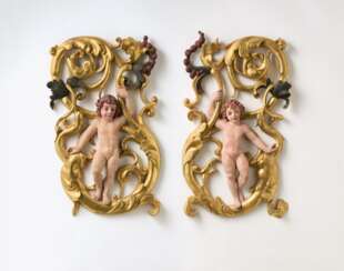 Pair of wall decorations with putti and golden vines