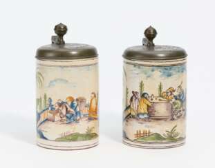 Two beer steins with gambling scene and scene with bread rolls