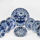 Large bowl and seven small plates with different blue decors - photo 1