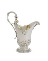 A GEORGE III SILVER CREAM JUG