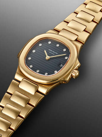 PATEK PHILIPPE, YELLOW GOLD AND DIAMOND-SET 'LADY NAUTILUS', REF. 4700 - photo 2