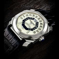 GERALD GENTA. AN 18K WHITE GOLD AUTOMATIC JUMP HOUR WRISTWATCH WITH RETROGRADE MINUTE AND DATE
