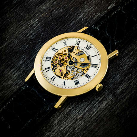 BREGUET. AN EARLY 18K GOLD SEMI-SKELETONISED WRISTWATCH - photo 1