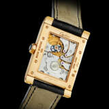 CARTIER. AN 18K PINK GOLD RECTANGULAR DUAL TIME WRISTWATCH - photo 2