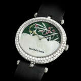 VAN CLEEF AND ARPELS. A LADY’S UNIQUE AND ELEGANT 18K WHITE GOLD AND DIAMOND-SET WRISTWATCH WITH DATE AND MONTH INDICATOR, ENAMEL WITH FAIRY MOTIFS AND MOTHER-OF-PEARL DIAL - photo 2