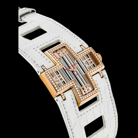 ROGER DUBUIS. A LADY’S 18K PINK GOLD AND DIAMOND-SET LIMITED EDITION CROSS-SHAPED WRISTWATCH - photo 1