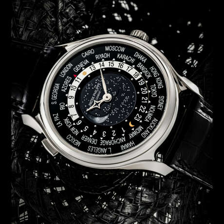 PATEK PHILIPPE. A RARE 18K WHITE GOLD LIMITED EDITION AUTOMATIC WORLD TIME WRISTWATCH WITH MOON PHASES, MADE TO COMMEMORATE THE 175TH ANNIVERSARY OF PATEK PHILIPPE IN 2014 - фото 1