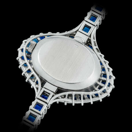PATEK PHILIPPE. A LADY’S POSSIBLY UNIQUE AND ELEGANT 18K WHITE GOLD, DIAMOND AND SAPPHIRE-SET BRACELET WATCH - photo 3
