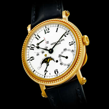 PATEK PHILIPPE. AN 18K GOLD AUTOMATIC WRISTWATCH WITH POWER RESERVE AND MOON PHASES - фото 1