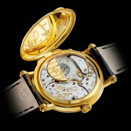 PATEK PHILIPPE. AN 18K GOLD AUTOMATIC WRISTWATCH WITH POWER RESERVE AND MOON PHASES - photo 2