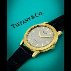 PATEK PHILIPPE. A RARE 18K GOLD AUTOMATIC WRISTWATCH, RETAILED BY TIFFANY &amp; CO.