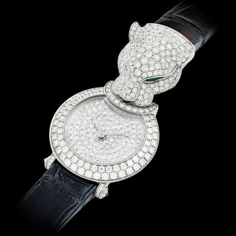 CARTIER. A LADY’S ATTRACTIVE 18K WHITE GOLD, DIAMOND, EMERALD AND ONYX-SET WRISTWATCH - photo 2
