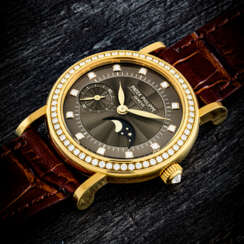 PATEK PHILIPPE. A LADY’S 18K GOLD AND DIAMOND-SET WRISTWATCH WITH MOON PHASES