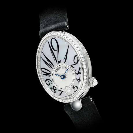 BREGUET. A LADY’S 18K WHITE GOLD AND DIAMOND-SET AUTOMATIC WRISTWATCH WITH MOTHER-OF-PEARL DIAL - Foto 1