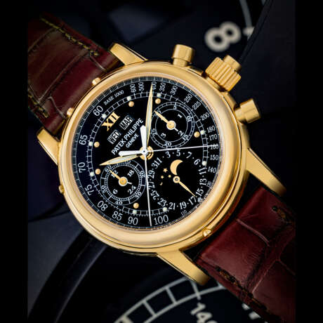 PATEK PHILIPPE. AN IMPORTANT AND POSSIBLY UNIQUE 18K GOLD SPLIT SECONDS CHRONOGRAPH PERPETUAL CALENDAR WRISTWATCH WITH MOON PHASES, 24 HOUR, LEAP YEAR INDICATION AND BLACK MONOGRAM DIAL WITH LUMINOUS HOUR MARKERS AND TACHYMETER SCALE - фото 1