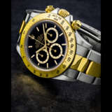 ROLEX. A RARE STAINLESS STEEL AND 18K GOLD AUTOMATIC CHRONOGRAPH WRISTWATCH WITH BRACELET AND “FLOATING” DIAL - photo 1