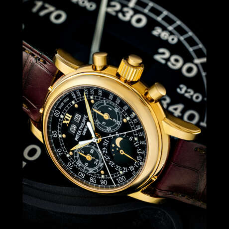 PATEK PHILIPPE. AN IMPORTANT AND POSSIBLY UNIQUE 18K GOLD SPLIT SECONDS CHRONOGRAPH PERPETUAL CALENDAR WRISTWATCH WITH MOON PHASES, 24 HOUR, LEAP YEAR INDICATION AND BLACK MONOGRAM DIAL WITH LUMINOUS HOUR MARKERS AND TACHYMETER SCALE - фото 2