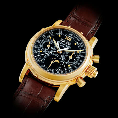 PATEK PHILIPPE. AN IMPORTANT AND POSSIBLY UNIQUE 18K GOLD SPLIT SECONDS CHRONOGRAPH PERPETUAL CALENDAR WRISTWATCH WITH MOON PHASES, 24 HOUR, LEAP YEAR INDICATION AND BLACK MONOGRAM DIAL WITH LUMINOUS HOUR MARKERS AND TACHYMETER SCALE - photo 4