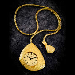 PATEK PHILIPPE. AN 18K GOLD ASYMMETRICAL POCKET WATCH WITH FITTED CHAIN