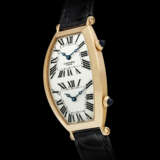 CARTIER. AN 18K PINK GOLD TONNEAU-SHAPED DUAL TIME WRISTWATCH - photo 1