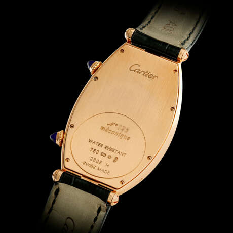 CARTIER. AN 18K PINK GOLD TONNEAU-SHAPED DUAL TIME WRISTWATCH - photo 2